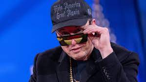 Elon Musk waves chainsaw before giving DOGE update at CPAC