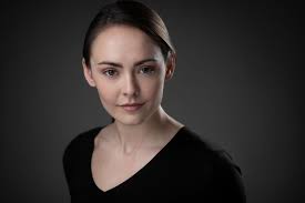 Who can take a professional headshot?