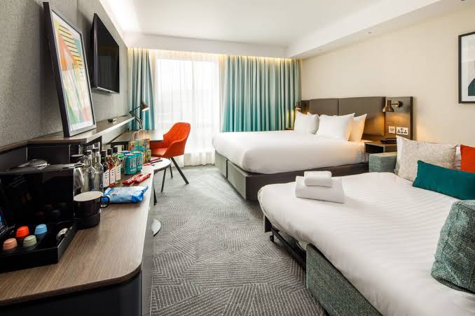 Comfortable overnight hotel accommodation near UK terminals, AI generated