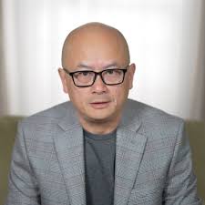 Demi Chang, Chinese American comedian, USMC veteran.