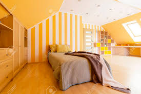 And avoid black, so as not to veer into halloween territory. Shot Of A Spacious Modern Bedroom With Orange Walls Stock Photo Picture And Royalty Free Image Image 63521837