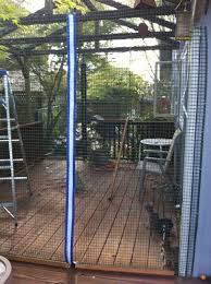 Quick Pic Of The New Diy Cat Enclosure I Enclosed The Arbor Over My Deck With Bird Netting And Plastic Fencin Cat Enclosure Outdoor Cat Enclosure Cat Playpen