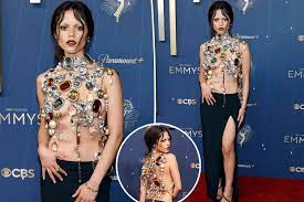Jenna Ortega is draped in jewels (and not much else) on Emmys 2025 red  carpet