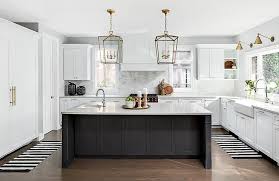 Well Appointed Black And White Kitchen Boasts A Black Center Island Topped With A White Quartz Count Kitchen Design New Kitchen Cabinets Gorgeous White Kitchen
