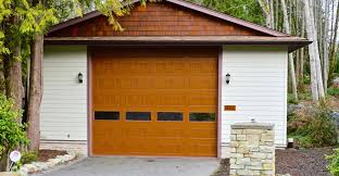 Contemporary garage doors constructed from reclaimed redwood sourced from various dismantled structures throughout the united states, including old barns and bridges, as well as wine, olive, water and other tanks. Custom Sheds Construction In Greater Victoria Bc