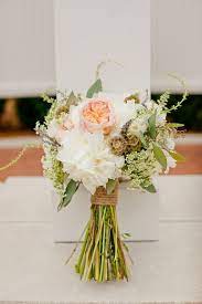 Decide on your color scheme: Make Your Very Own Rustic Wedding Bouquet Like This One Diy Tutorial Rustic Bridal Bouquets Rustic Wedding Flowers Wedding Flowers