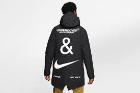 The silhouette features a speckled midsole and extended heel clip with a mix of different materials on. Nike X Undercover