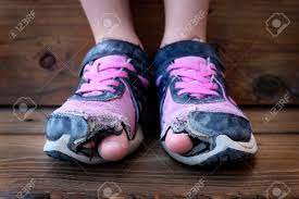 Shoes with holes in them. Detailed Photo Of Shoes With Holes In Them And Toes Sticking Stock Photo Picture And Royalty Free Image Image 41457299