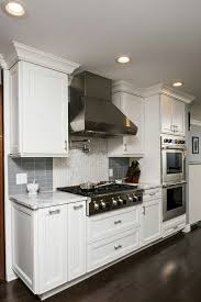 Wolf Rangetop Range Hood Double Oven With Custom Backsplash Kemper Cabinets And Delta Kitchen Cabinets With Black Appliances Kitchen Marble Top Double Oven