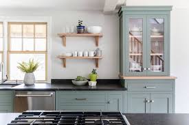 Sage Green Cabinets Black Counter Top And Stainless Appliances Still Has A Clean And Green Kitchen Cabinets Kitchen Black Counter Black Appliances Kitchen