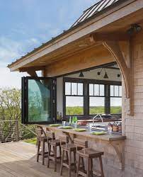 Outdoor entertaining · even heating · stainless steel An Indoor Outdoor Serving Bar Opens The Possibilities
