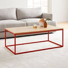 Pool finished with a hot top is fixed in front of glass folding doors that open to a pool house fitted with a round rustic coffee table flanked by white slipcovered sofas heated by a stone fireplace centered between built in wood storage space. Streamline Coffee Table Rustic Oak