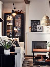 A Living Room With Warm Wood And Traditional Elements Ikea Living Room Glass Cabinet Doors Cozy Living Rooms