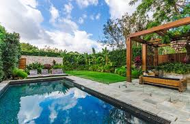 How can landscaping enhance a pool area? Pool Builders Landscaping Sydney Swimming Pool Renovations Repairs