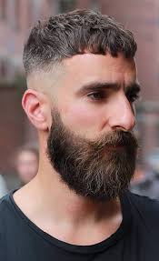 A structured silhouette to the top hair makes this skin fade hairstyle for short hair look majestic, especially with the beard being balanced well by the style. Top 30 Hairstyles For Men With Beards