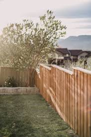 How to stain a wood cedar fence fast with an airless paint sprayer and a stain brush. Staining A Fence With A Sprayer Diy Tips Lemon Thistle
