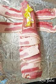 How should you season pork loin roast? Bacon Wrapped Pork Loin Stuffed With Cream Cheese Pepperoncini Rose Bakes