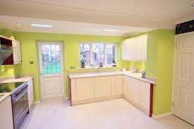 Cream And Red Gloss Units Lime Green Walls Designed Supplied And Installed By Kitchencraft Essex Lime Green Walls Green Wall Design Cream Kitchen Designs