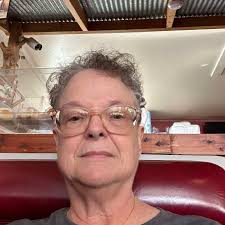 If Mrs. Brown could host a dinner party, who would she invite?