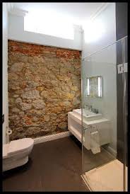 Galvanized tub, stone wall, antique dresser, wood floors w/ painted tile pattern, walls, door, light.everything about. Stone Wall In Bathroom Picture Of The Three Boutique Hotel Cape Town Central Tripadvisor