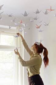 Start with a square sheet of paper. Diy Renters Friendly Origami Ceiling Decoration