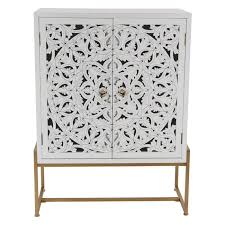 Since all our modifications ship complete from the factory, your install is easier and faster than ever. Decmode White Carved Medallion 2 Door Brass Cabinet