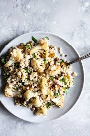 Cook and stir couscous in the hot oil until toasted and fragrant, 3 to 4 minutes. Israeli Couscous Salad With Roasted Cauliflower Pistachios Dates Recipe Couscous Recipes Israeli Couscous Salad Couscous Salad