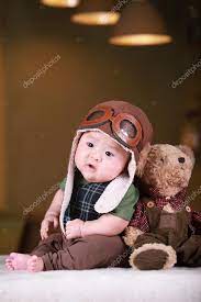 Happy Cute 3 Month Old Asian Baby Boy Playing On Bed With Colorf Stock Photo By C Addingwater 30157379