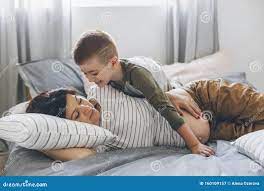 Mom and son share the bed