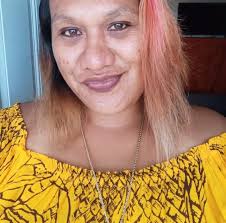 Hi Can someone make this picture clearer up to you .My sister standing up  has brown hair ,Thanks in advanced x 🌻