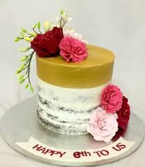 Dessert designs concocted a cake with height for this wedding, but kept the cream cheese frosting beautifully simple. Online Designer Anniversary Cakes Bangalore Custom Designed Wedding Anniversary Cakes Delivered