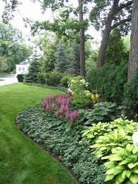 17 Ideas For Low Maintenance Landscape Design Driveways Pea Gravel In 2020 Shade Garden Traditional Landscape Front Yard Landscaping