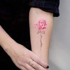Rose tattoos symbolize love and happiness, but it can also represent sadness when used as a memorial tattoo.rose tattoos can also be combined with anchor tattoos. Tatto Wallpapers Rose Tattoo With Writing