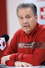 New Arkansas Razorbacks basketball head coach John Calipari holds his...  News Photo