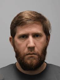 Tennessee teacher who admitted to filming students in locker room cries in  court