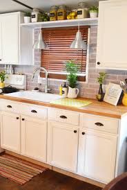 An even simpler diy kitchen backsplash idea is to cut larger sheets of patterned vinyl based on the size of your backsplash and cover the backsplash the brick paneling is cut to fit the backsplash space and the outlets. 5 Gorgeous Brick Diy Backsplash Tutorials