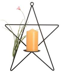 Many people believe that a candle lit in ones home pleases the fire element and brings good fortune to the aura of the house. Amish Handcrafted Wrought Iron Star Tea Light Votive Candle Holder Metal Stand Home Decor Home Garden