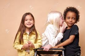 Two boys, one with albinism, pose against a stark white wall. Albino Girl With White Hair And Skin Tell Secret To Black African Stock Photo Picture And Royalty Free Image Image 147126456