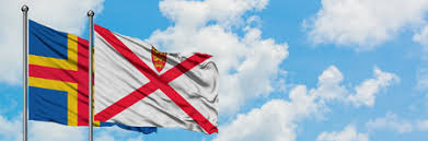 The flag of the åland islands was adopted in 1954, the flag is blue with a red scandinavian cross fimbriated yellow. Foto Von Aland Islands And Jersey Flag Id 123031616 Lizenzfreie Bild Stocklib