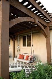 Free Standing Diy Timber Frame Pergola Kit Installed Over Backyard Deck With Full Arched Knee Braces And Decorative Keystones With Old World Craftsmanship With