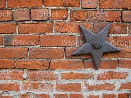 Starshaped Iron Support In A Brick Wall Stock Photo - Download Image Now -  Brick, Building Exterior, Texas - Istock