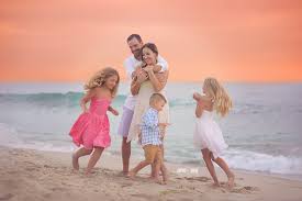 When you're coming up with colors for your sunset couple or family photo, moderation is essential. San Diego Sunset Beach Family Photography Sophie Crew Photography San Diego Newborn Photographer