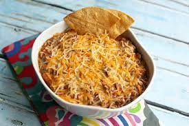 Hamburger meat browned and drain grease • block of velveeta cheese cubes up (use half for a smaller crockpot) for more cheesy use 2 blocks of cheese • big jar of pace picante sauce (or 2 smaller jars) • fiesta nacho cheese soup 10 Velveeta Cheese Recipes Your Family Will Love