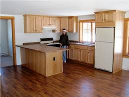 If you want to install linoleum or wood laminate flooring (also known as a floating floor) this can typically be done without removing cabinets; Laminate Flooring With Oak Cabinets Laminate Flooring