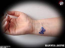 Tiny Blue Butterfly Tattoo On Wrist Tattooshunt Com Purple Butterfly Tattoo Butterfly Wrist Tattoo Blue Butterfly Tattoo