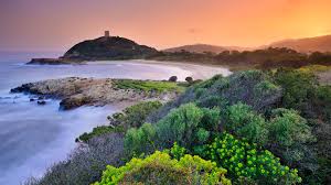 Cagliari is a place where the beach definitely has a good go at outshining the town, and the public bus makes it easy to get to. Su Portu Beach And Chia Genovese Viewing Tower Cagliari Sardinia Italy Windows 10 Spotlight Images