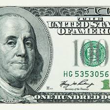 Part of a hundred american dollar bill close-up.