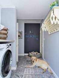 If the rest of your home has a neutral palette, introducing a darker color like this one can keep a uniform look from room to room while still giving your laundry room a purposeful feel. Best Laundry Room Paint Color Ideas Sebring Design Build