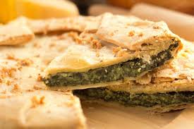 Qual è un buon modo per consumare oltre mezzo chilo di cime di rapa che da 3 giorni vegetano nel frigorifero? Rustico Alle Cime Di Rapa Ricetta Ingredienti Preparazione
