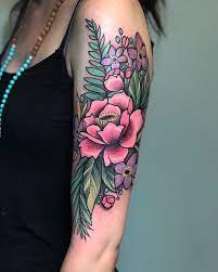 Neo Traditional Wildflowers Tattoo On The Left Upper Arm Traditional Tattoo Flowers Modern Tattoos Traditional Tattoo Sleeve